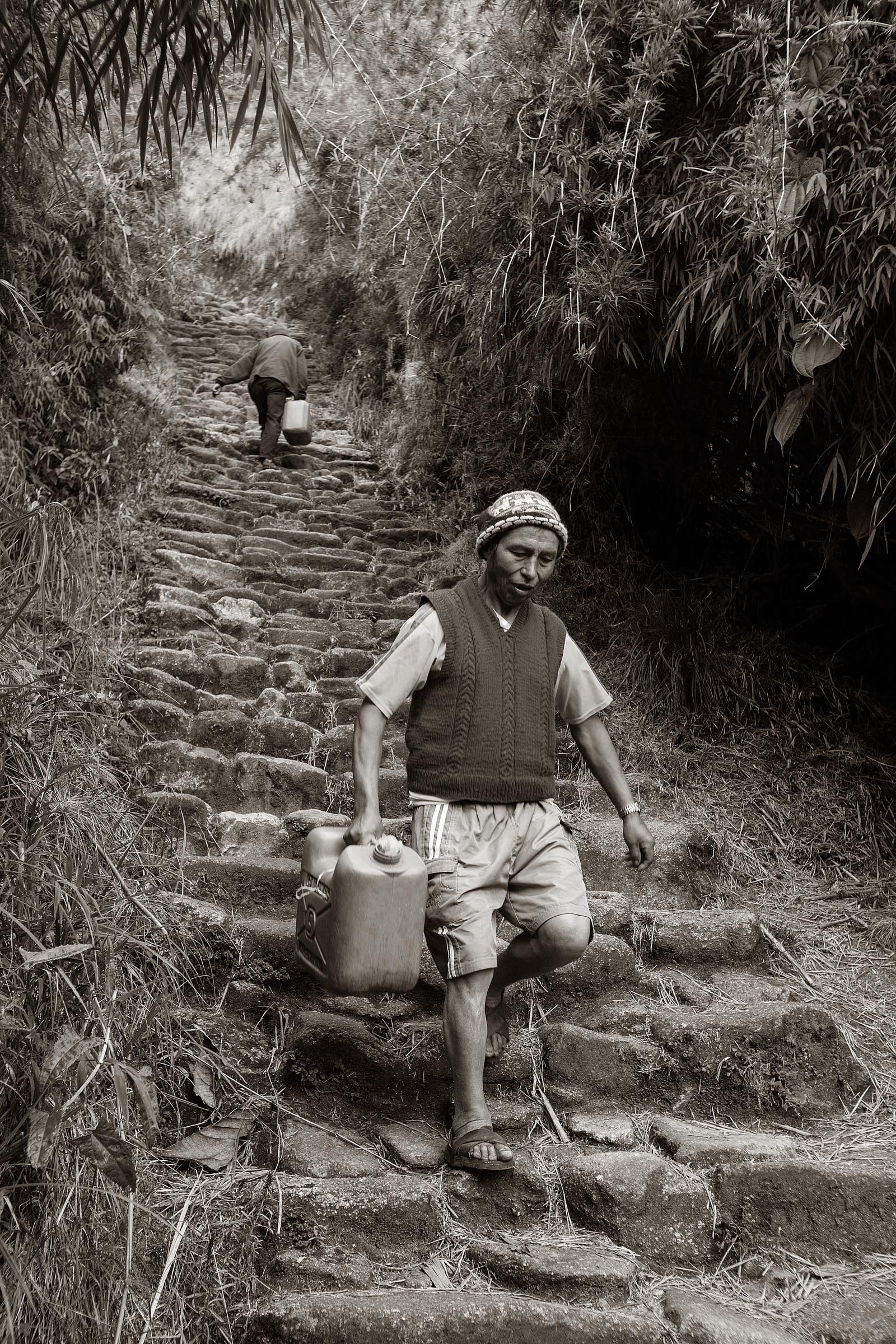 Porters going to and from a water supply at the Phuyupatamarca ruins.