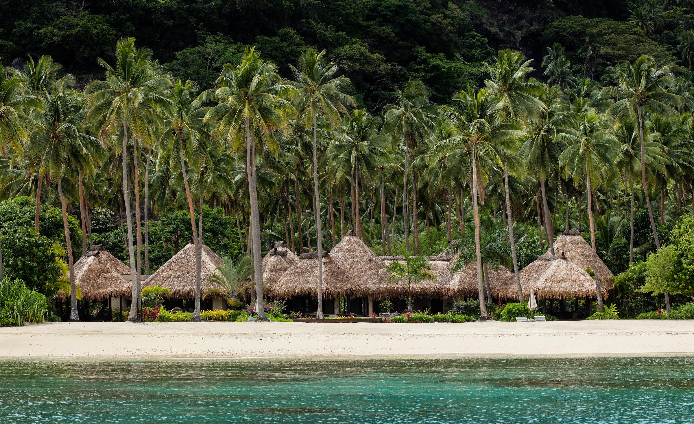 Private villas along the shore at the Laucala Island Resort.